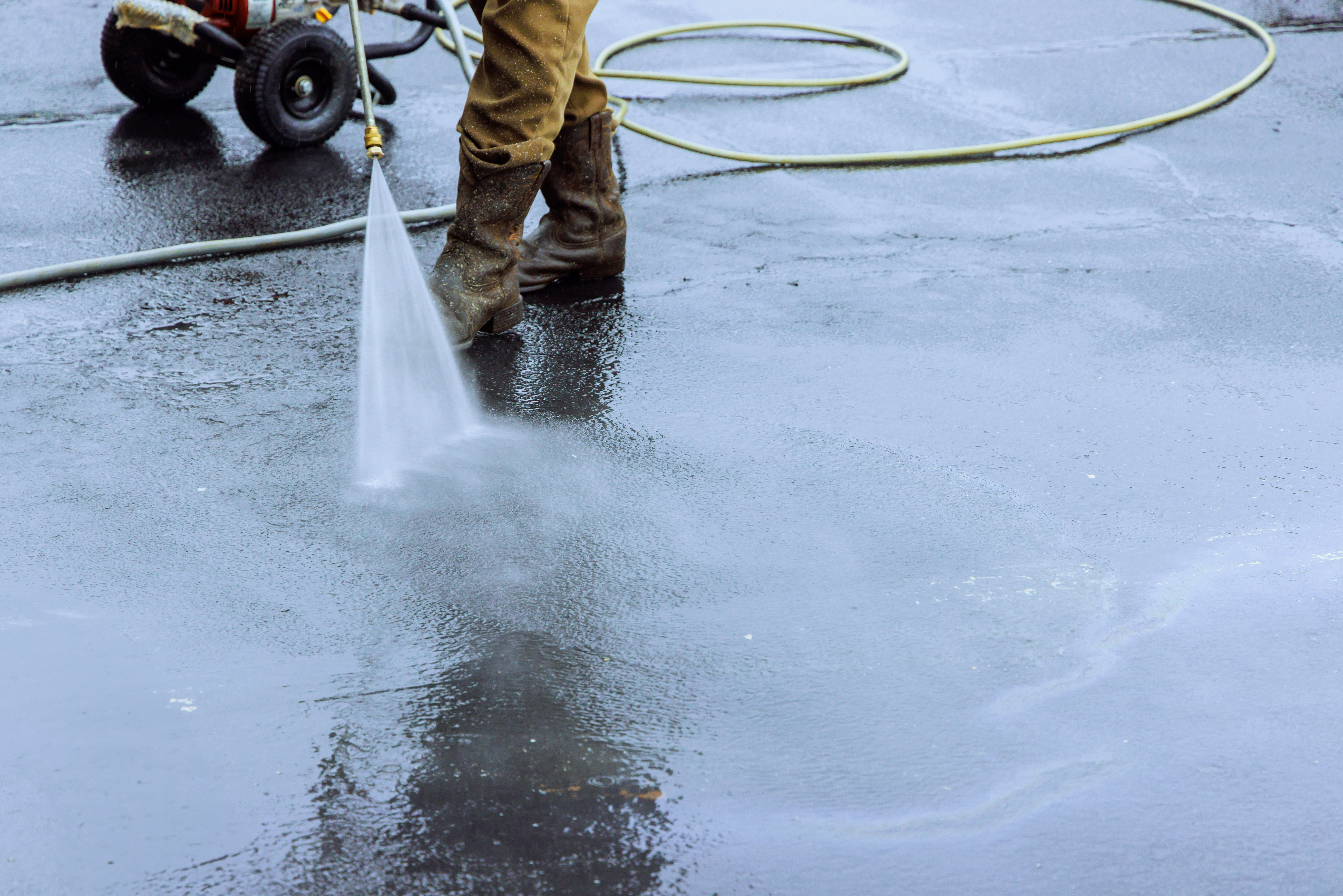 Pressure washing street and commercial surface